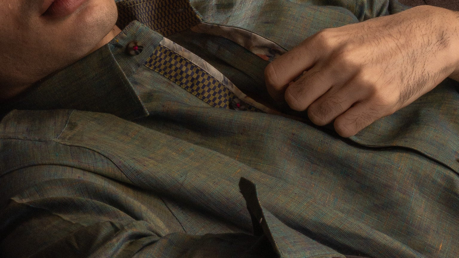 Close-up of a person wearing a green shirt.